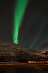 Fototapeta na wymiar Aurora Borealis over the Lyngenfjord in arctic Norway