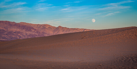 The Moon Rises After Sunset on the Dunes, Mesquite Flat Sand Dunes, Death Valley National Park,...
