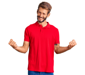 Handsome blond man with beard wearing casual clothes very happy and excited doing winner gesture with arms raised, smiling and screaming for success. celebration concept.