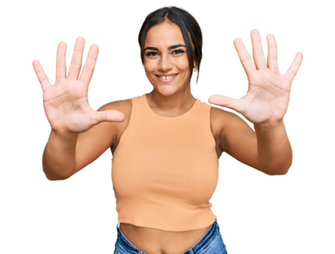 Young brunette woman wearing casual clothes showing and pointing up with fingers number ten while smiling confident and happy.