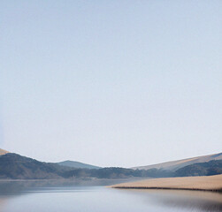 Lake and mountains. Minimalist background with empty copy space. Nature backdrop. Beautiful natural flyer, card design. Nature Template for presentation or product.