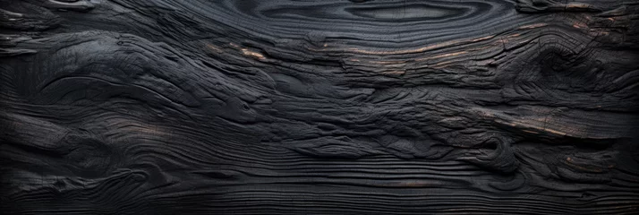 Fotobehang Brandhout textuur Burnt wood texture background, wide banner of charred black timber. Abstract pattern of dark burned scorched woodgrain. Concept of charcoal, coal, grill, embers, wallpaper, tree, firewood
