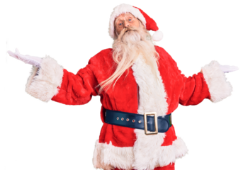 Old senior man with grey hair and long beard wearing traditional santa claus costume clueless and confused expression with arms and hands raised. doubt concept.