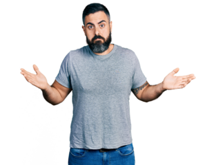 Hispanic man with beard wearing casual grey t shirt clueless and confused with open arms, no idea and doubtful face.