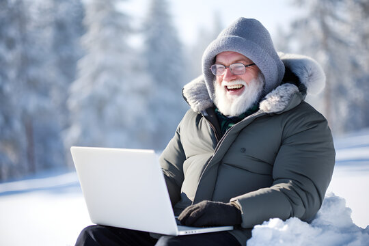 Senior Man Working Remotely On Laptop On Winter Vacation - Happiness Digital Nomad Remote Work Business Lifestyle Concept