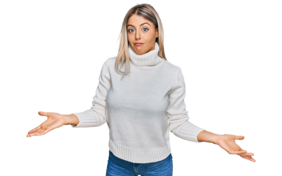 Beautiful blonde woman wearing casual turtleneck sweater clueless and confused expression with arms and hands raised. doubt concept.