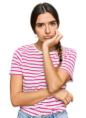 Young hispanic woman wearing casual clothes thinking looking tired and bored with depression problems with crossed arms.