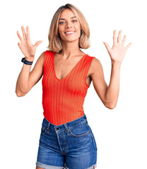 Fototapeta na wymiar Beautiful caucasian woman wearing casual clothes showing and pointing up with fingers number nine while smiling confident and happy.