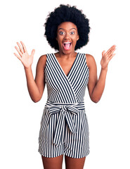 Young african american woman wearing casual clothes celebrating crazy and amazed for success with arms raised and open eyes screaming excited. winner concept