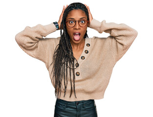 African american woman wearing casual clothes crazy and scared with hands on head, afraid and...