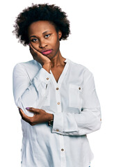 African american woman with afro hair wearing casual white t shirt thinking looking tired and bored with depression problems with crossed arms.