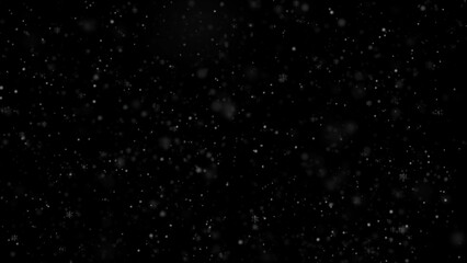 Snowfall isolated on a black background. White snow. Snowflakes overly texture