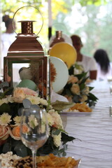 floral bouquet of flowers and event setup with wnie glasses 