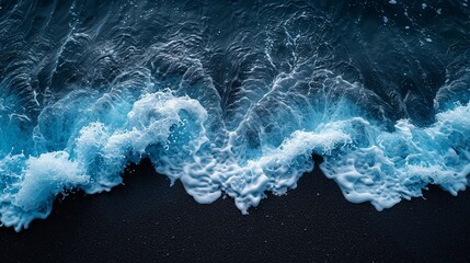 Crystal clear blue ocean waves on a black beach. Colorful contrasting surf - obrazy, fototapety, plakaty