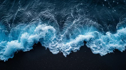  Crystal clear blue ocean waves on a black beach. Colorful contrasting surf © NeuroSky