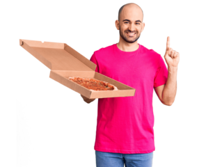 Young handsome man holding delivery pizza cardboard box surprised with an idea or question pointing finger with happy face, number one
