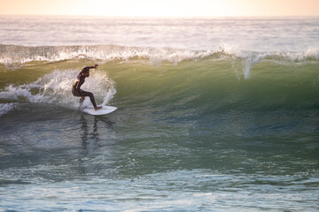 Young surfer enjoying waves