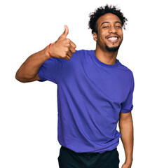Naklejka premium Young african american man with beard wearing casual purple t shirt doing happy thumbs up gesture with hand. approving expression looking at the camera showing success.