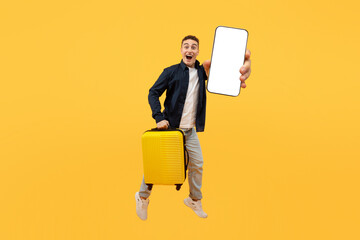 Tourism and holiday trip concept, guy showing phone, holding suitcase