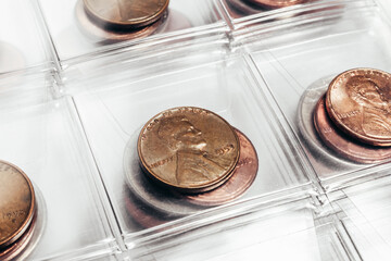 Photo of US president Lincoln cent coins collection in a clear plastic sheet numismatic holder.