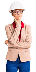 Young beautiful woman wearing architect hardhat thinking looking tired and bored with depression problems with crossed arms.