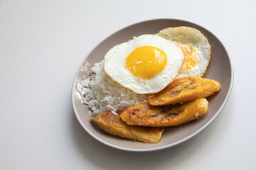 White rice with english fried egg and fried bananas cuban food simple comfort food