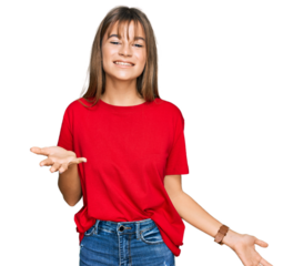 Teenager caucasian girl wearing casual red t shirt smiling cheerful with open arms as friendly welcome, positive and confident greetings