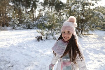 Obraz premium Cute little girl outdoors on winter day. Christmas vacation