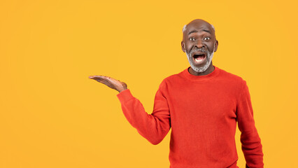 Happy shocked senior african american man with beard, open mouth