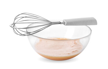 Beaten eggs in glass bowl and whisk isolated on white