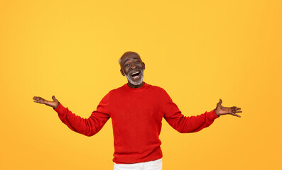 Joyful senior Black man with a white beard laughing and spreading his arms wide open