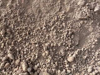 Sunlight, soil background, brown texture. Brown soil.
