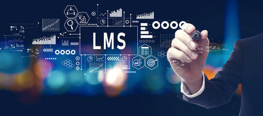 LMS - Learning Management System with businessman in a city at night