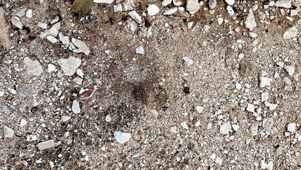 Surface image: coarse sand mixed with rocks. Construction area