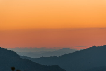 Sunset mountain range beautiful landscape mist, dusk golden time dramatic sky. Beautiful landscape high mountain ridge mist panning panorama scenery dawn dramatic sky. Sunrise landscape mountain peak.