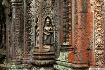 Apsara dancer carved in stone at Ta Prohm Temple, Siem Reap, Cambodia - obrazy, fototapety, plakaty