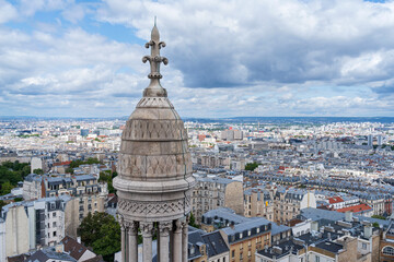 Fototapeta na wymiar paris cityscape and cupola atop dome of sacred heart of jesus montmartre reaching above horizon