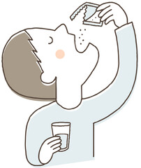 粉薬を飲む男性