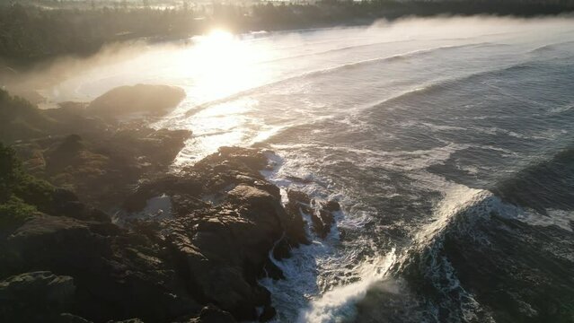 Drone over coastal point with waves