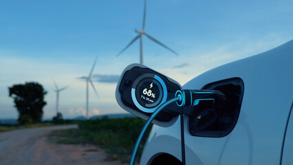 Electric car recharging energy from EV charging station display futuristic smart battery status...