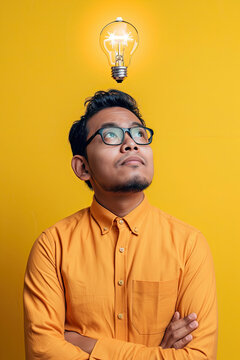 A thinking Malay man with a lightbulb on his head