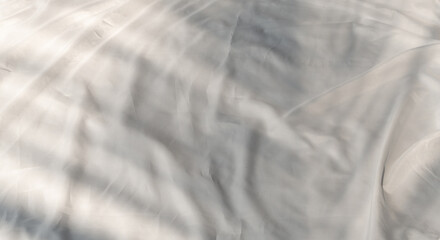 Obraz premium Curtain white wave and soft shadow of palm leaves. abstract background on isolated with shade leaf tropical and copy space.