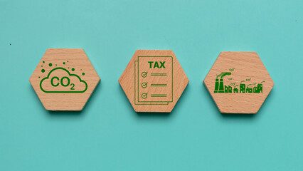 Wooden with CO2 TAX word. Concept of Co2 Tax.Carbon tax, environmental and social responsibility...