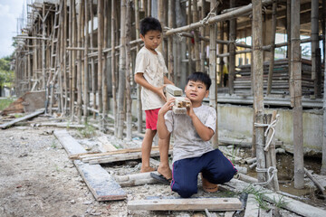 Children working at construction site for world day against child labor concept, human trafficking, poor child labor.