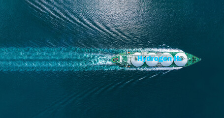 Liqiud Hydrogen renewable energy in vessel H2 hydrogen gas green energy . Hydrogen tanker ship. Red...