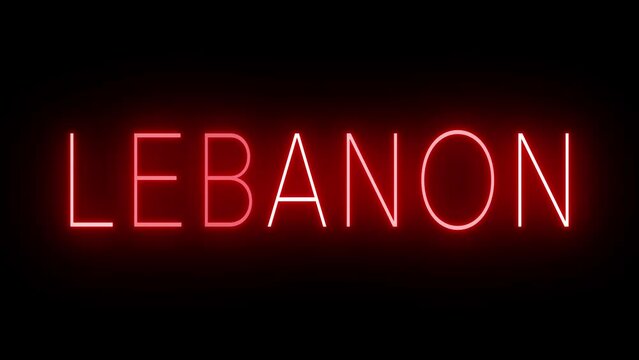 Flickering red retro style neon sign glowing against a black background for LEBANON
