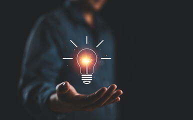 Creative idea. Concept of idea and innovation, Businessman holding light bulb. Creative thinking...