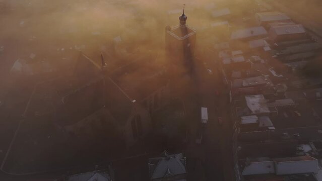 Aerial drone view of church foggy morning, Workum, Friesland, Netherlands