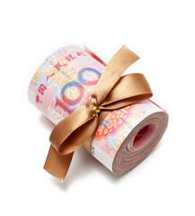 Roll of chinese yuan banknotes tied with gold ribbon isolated on white