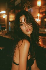 A sultry woman in a bar casts a pensive gaze, illuminated by warm, ambient lighting